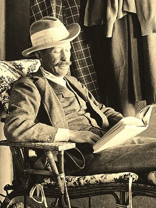 George_Herbert_5th_Earl_of_Carnarvon_reading_cropped.jpg